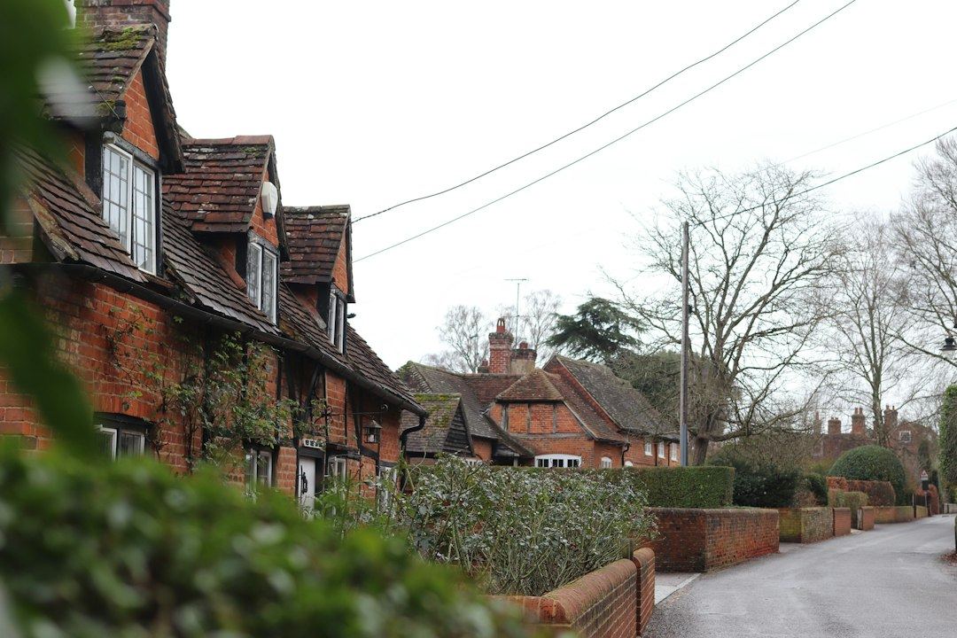 Row of traditional brick houses along a quiet street