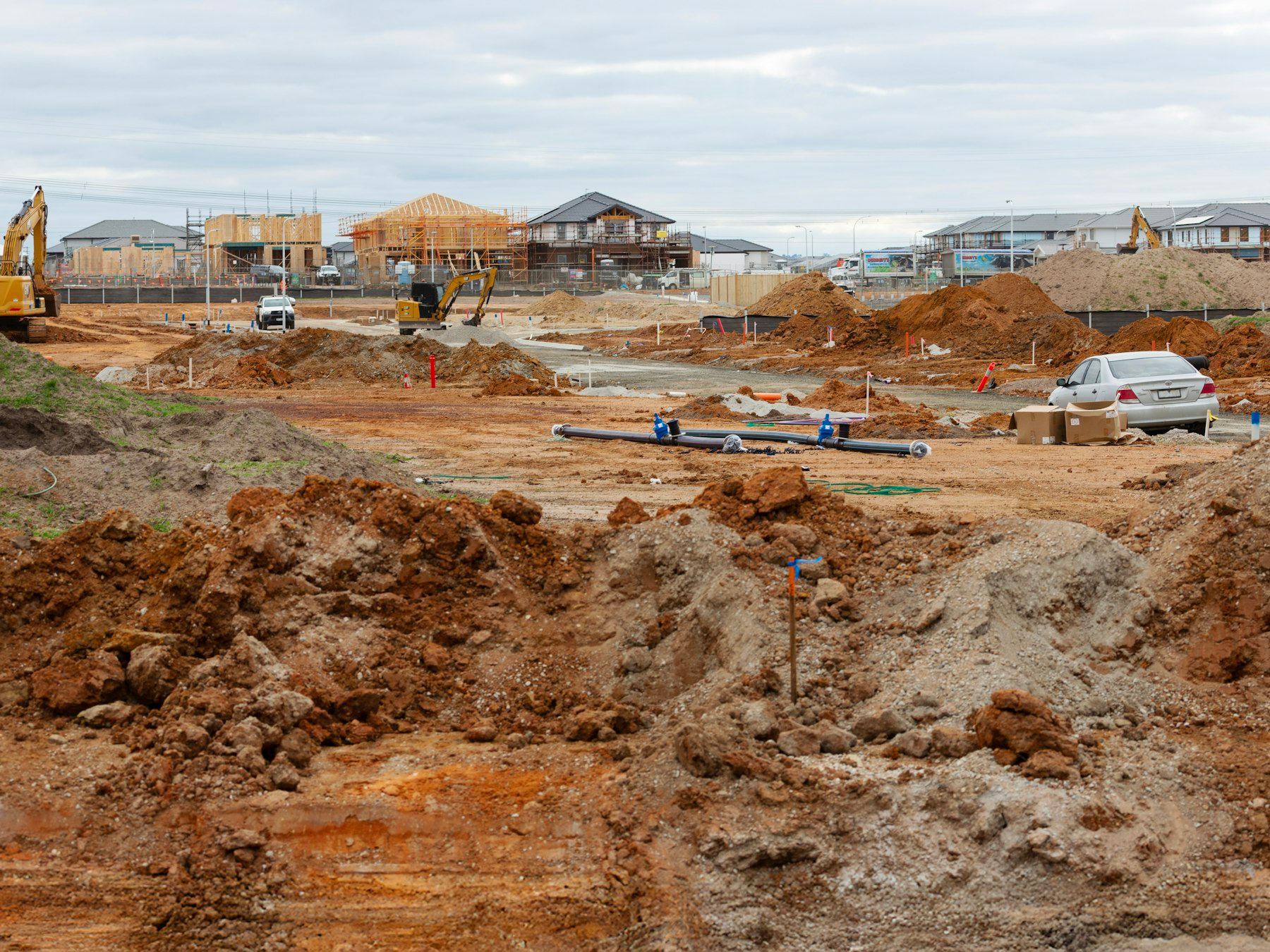 Construction site with houses and heavy machinery